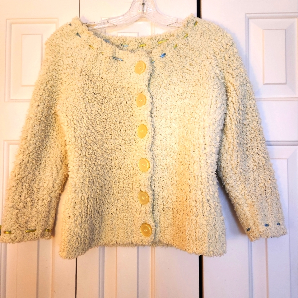 Fluffy sweater with ribbon trim. Light green